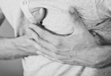 12 Best Fruits For The Heart A picture of a man holding his left chest region