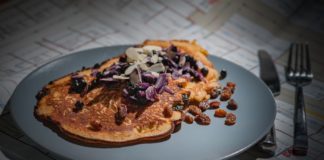 Dried Fruits and their Health Benefits A picture of raisins in a plate