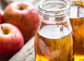 Benefits and Side Effects of Apple Juice A picture of apples and some apple cider vinegar