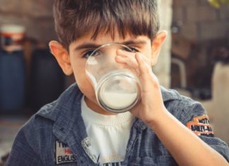 21 Health Benefits of Buttermilk A boy drinking buttermilk