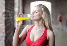 Rejuvenate your Body with Full Body Detoxing a woman drinking some juice