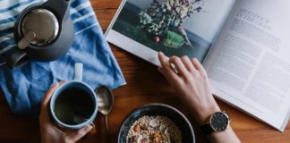 Healthy Living 101 An image of a person who is reading and also about to eat.