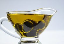14 Side Effects of Olive Oil a cup of olive oil