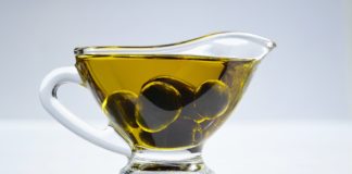 14 Side Effects of Olive Oil a cup of olive oil