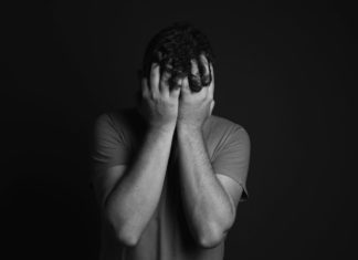 Panic Disorder: Causes & Treatment A man with his head in his hands