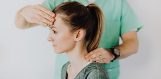 Concussion; A Severe Brain Injury Therapist massaging patient