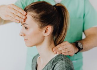 Concussion; A Severe Brain Injury Therapist massaging patient