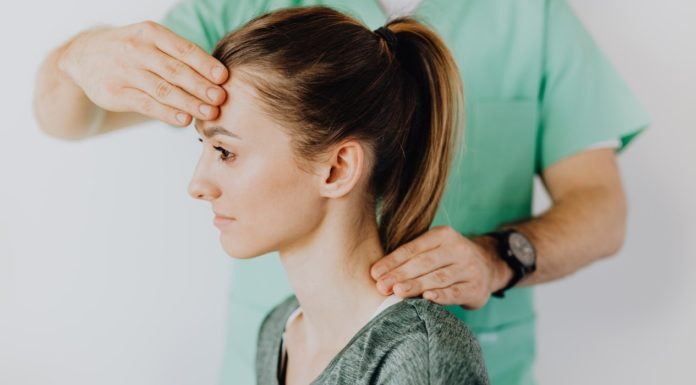 Concussion; A Severe Brain Injury Therapist massaging patient