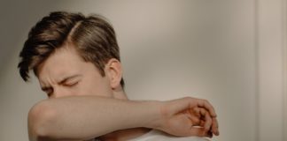 Sinus; Causes, Prevention, and Treatment man sneezing