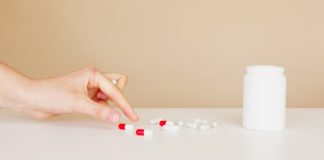 Health Risks of Drugs Overdose picking up a tablet